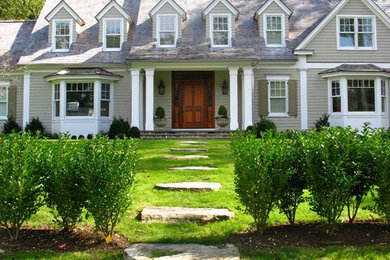 Inspiration for a large traditional front yard partial sun garden in New York with a garden path.