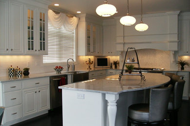 Inspiration for a transitional dark wood floor kitchen remodel in Other with a farmhouse sink, raised-panel cabinets, white cabinets, white backsplash, ceramic backsplash, stainless steel appliances and an island