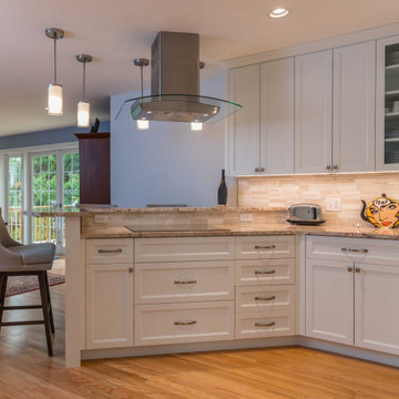 Modern Kitchen with White Flat Panel Shaker Cabinets & Natural Stone Backsplash