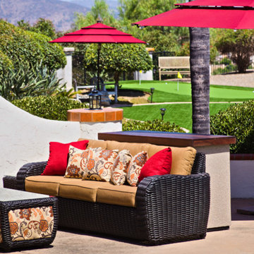 Outdoor TV lift stucco island cabinet hides TV and keeps it safe