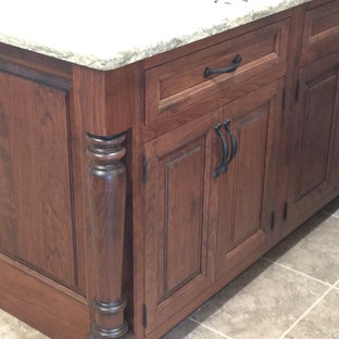 Mid-sized kitchen pantry inspiration - Mid-sized u-shaped kitchen pantry photo in Wilmington with raised-panel cabinets, white cabinets, quartz countertops and an island