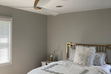 beautiful simple gold fan guest bedroom
