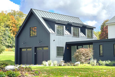Mid-sized trendy gray two-story board and batten exterior home photo in Boston with a metal roof and a black roof