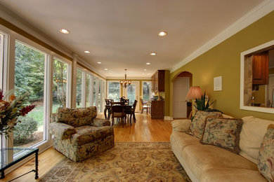Inspiration for a large transitional light wood floor sunroom remodel in Atlanta with a standard ceiling