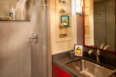 Alcove shower - mid-sized contemporary beige tile alcove shower idea in San Francisco with an undermount sink, flat-panel cabinets, red cabinets and beige walls