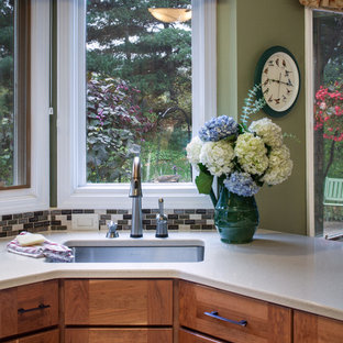 Large craftsman kitchen pantry photos - Example of a large arts and crafts u-shaped bamboo floor kitchen pantry design in Detroit with an undermount sink, shaker cabinets, medium tone wood cabinets, quartzite countertops, multicolored backsplash, stone tile backsplash, stainless steel appliances and a peninsula