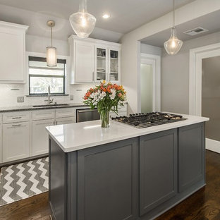 Large midcentury modern kitchen pantry photos - Inspiration for a large 1950s dark wood floor kitchen pantry remodel in Dallas with an undermount sink, shaker cabinets, gray cabinets, quartz countertops, white backsplash, ceramic backsplash, stainless steel appliances and two islands