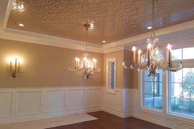 Large elegant medium tone wood floor and brown floor dining room photo in New York with brown walls and no fireplace