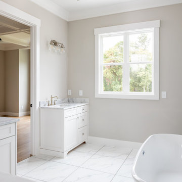 Owner's Bath with Freestanding Tub and Marble-Look Tile