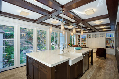 Design ideas for a large traditional l-shaped open plan kitchen in San Francisco with a farmhouse sink, shaker cabinets, dark wood cabinets, quartz benchtops, white splashback, stone slab splashback, stainless steel appliances, porcelain floors, with island, beige floor, white benchtop and coffered.