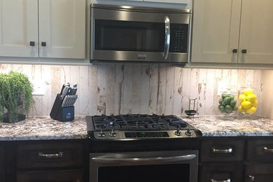 Example of a mid-sized mountain style l-shaped dark wood floor and brown floor eat-in kitchen design in Other with shaker cabinets, an island, beige backsplash, stainless steel appliances, beige cabinets, granite countertops, wood backsplash and multicolored countertops
