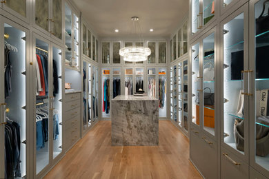 Walk-in closet - large contemporary gender-neutral light wood floor and beige floor walk-in closet idea in Dallas with shaker cabinets and gray cabinets