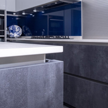 Handless Kitchen with Blue Splashback in Stanmore By Kudos Interior Designs