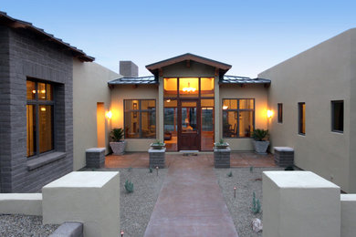 Example of a tuscan exterior home design in Phoenix