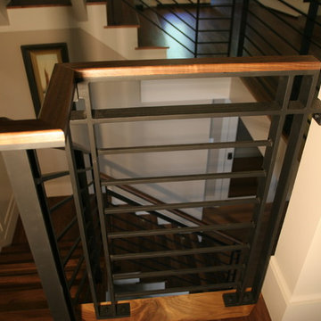 Open concept contemporary stairs with steal railing