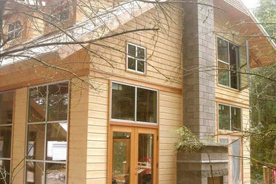 Design ideas for a mid-sized traditional two-storey beige exterior in Seattle with mixed siding.