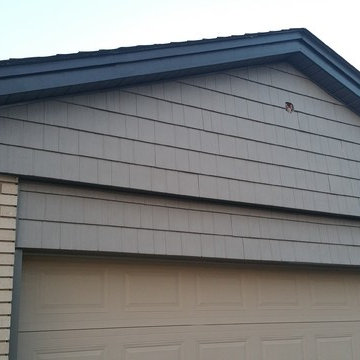 Vinyl shake (grey), Soffit, fascia and capping (iron ore)