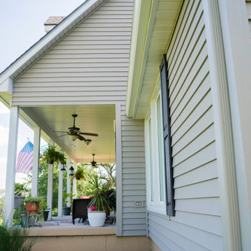 Seamless Polymer Siding in Mountain Clay w/ Energy Efficient Replacement Windows