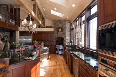 Kitchen - rustic kitchen idea in New York with a farmhouse sink and granite countertops