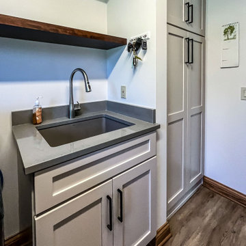 Laundry Room with Custom Cabinetry Quartz Countertop and Custom Floating Shelf