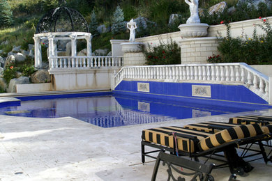 Hot tub - large mediterranean backyard brick and custom-shaped lap hot tub idea in Salt Lake City