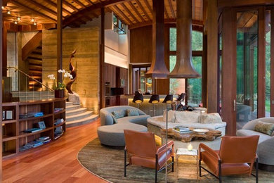 Inspiration for a mid-sized contemporary open concept medium tone wood floor game room remodel in Denver with beige walls