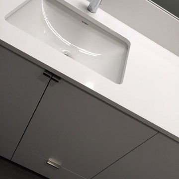 minimal white vanity at secondary bathroom