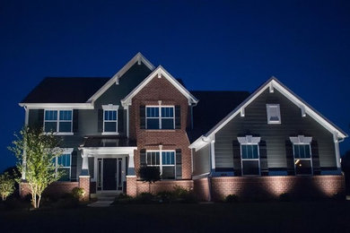 Inspiration for a mid-sized transitional green two-story mixed siding exterior home remodel in Indianapolis