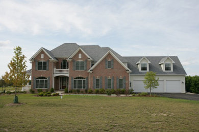 Inspiration for a red two-story stucco exterior home remodel in Chicago