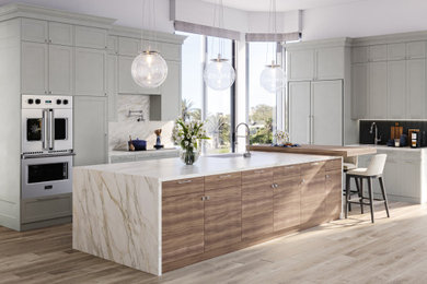 Example of a large transitional porcelain tile and brown floor kitchen pantry design in Other with a single-bowl sink, shaker cabinets, gray cabinets, quartz countertops, blue backsplash, porcelain backsplash, stainless steel appliances, an island and multicolored countertops