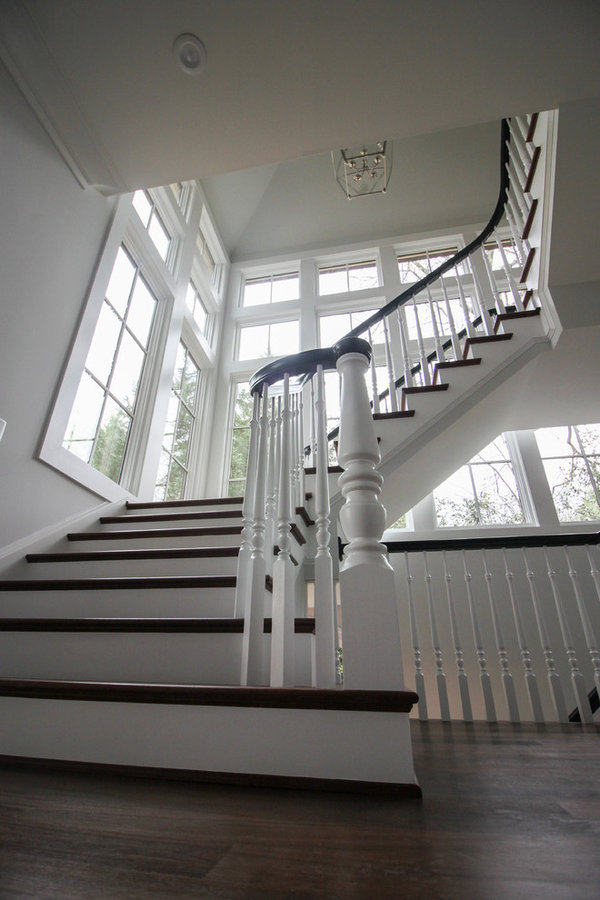 Powerful Impression by Floating Staircase in Suburban Foyer