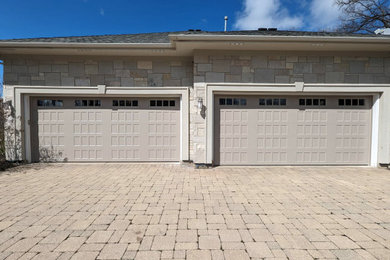 Example of a trendy four-car garage design in Chicago