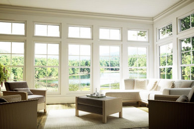 Living room - mid-sized transitional formal and open concept medium tone wood floor living room idea in Toronto with white walls, no fireplace and no tv