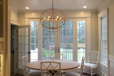 Example of a large transitional dark wood floor and brown floor kitchen/dining room combo design in Boston with beige walls