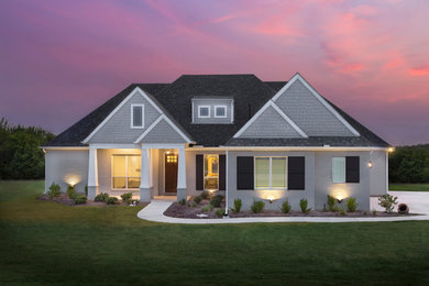 Mid-sized arts and crafts gray one-story brick exterior home photo in Dallas with a shingle roof