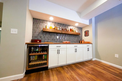 Example of a transitional home bar design in Cincinnati