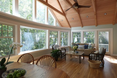 Inspiration for a large timeless medium tone wood floor and brown floor sunroom remodel in Boston with a standard ceiling