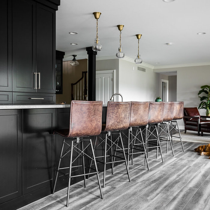 This lower level bar is the focal center for a busy family of five. Spending Michigan summers on the lake and entertaining friends and family sets the need for a design that allows for quick access an