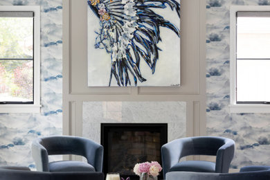 Example of a large transitional built-in desk wallpaper study room design in Denver with blue walls, a standard fireplace and a stone fireplace
