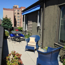 Penthouse NYC with awning retracted back - Awnings