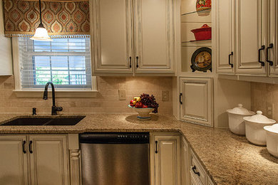 Large transitional u-shaped dark wood floor eat-in kitchen photo in Atlanta with a double-bowl sink, raised-panel cabinets, beige cabinets, granite countertops, beige backsplash, stone tile backsplash, stainless steel appliances and no island