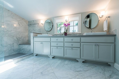 Mid-sized transitional master gray tile and marble tile marble floor and white floor bathroom photo in Atlanta with gray cabinets, a console sink, shaker cabinets, gray walls, quartz countertops and a one-piece toilet