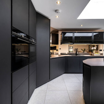 Dramatic black handleless kitchen