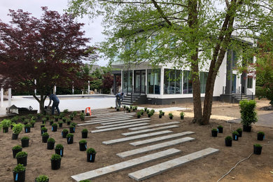 This is an example of a huge modern full sun stone walkway in New York.