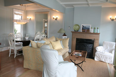 Inspiration for a shabby-chic style living room remodel in San Francisco with a wood fireplace surround