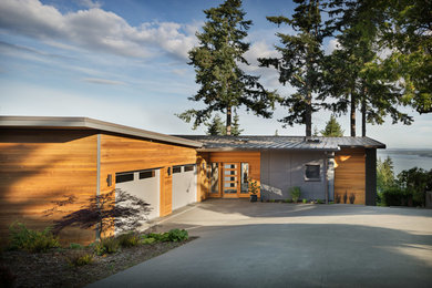 Mid-century modern exterior home idea in Seattle