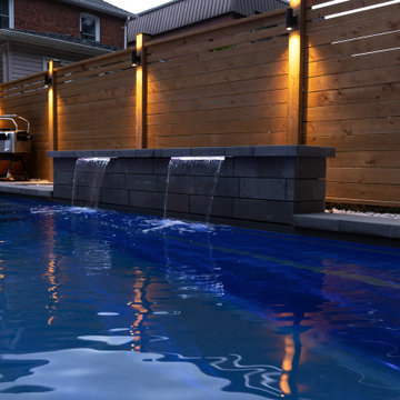 Modern Pool with Water Features & Backyard Landscape Design