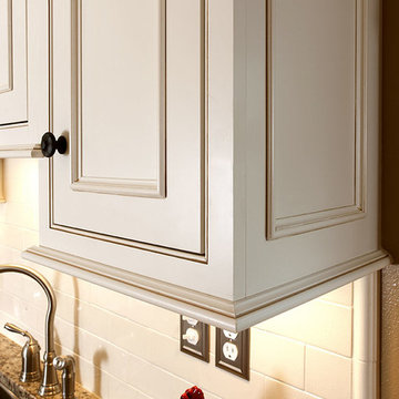 Door style: Savannah Inset | Species: Maple | Finish: Soft Cream with Carmel