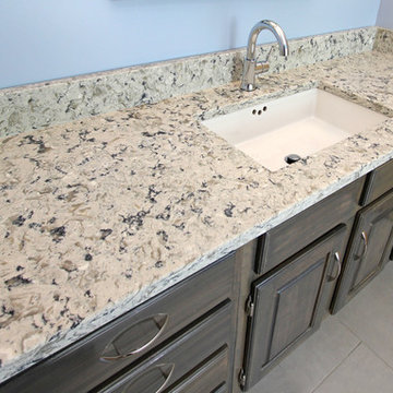 Master Bathroom with Free Standing Tub, Quartz Countertop and Grey Tiled Shower