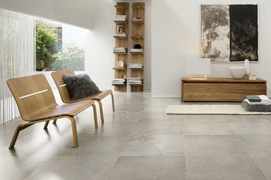 Inspiration for a large contemporary living room in Sydney with white walls, porcelain floors and grey floor.